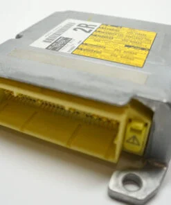 Toyota SRS airbag control module with yellow Denso connector — bench reset at Karman Auto